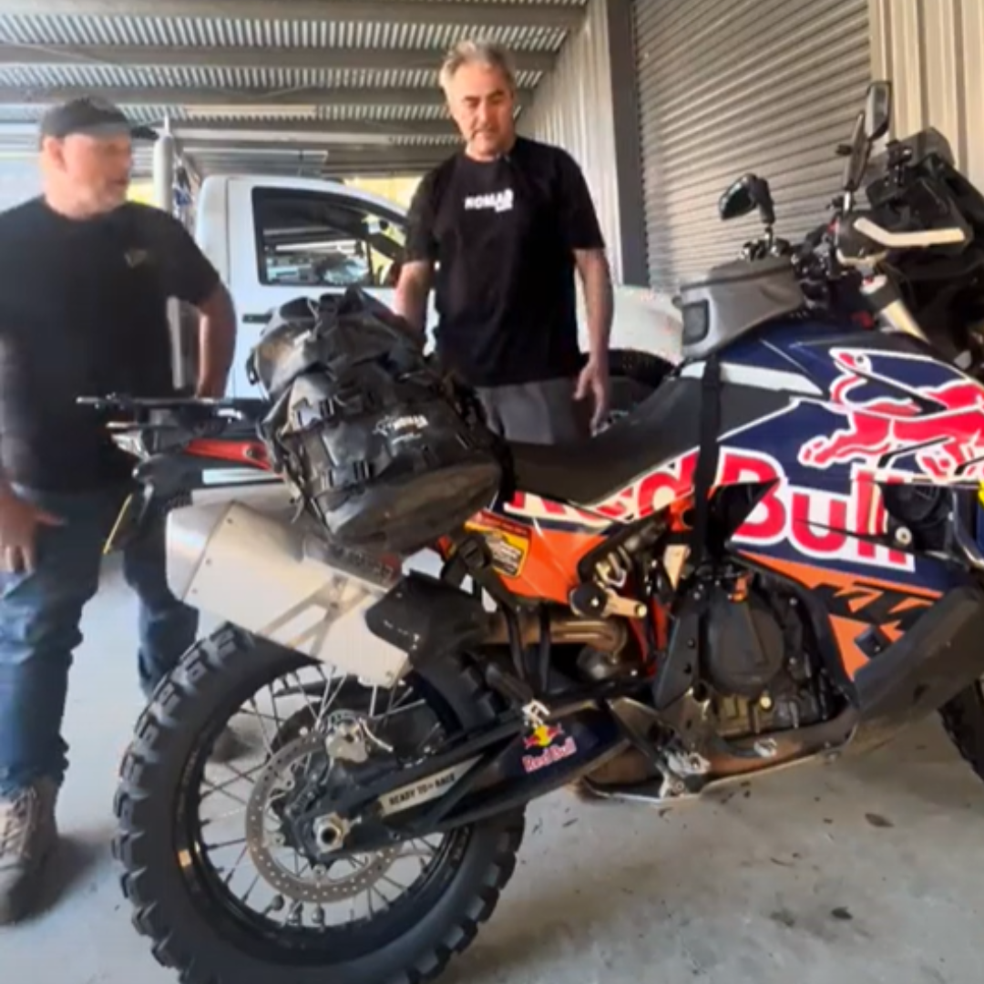 Adventure bike with waterproof soft luggage in the garage