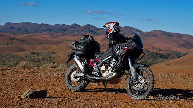 Adventure motorcycle loaded with soft panniers
