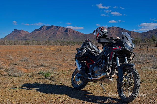 Motorcycle with panniers in the wild outdoors