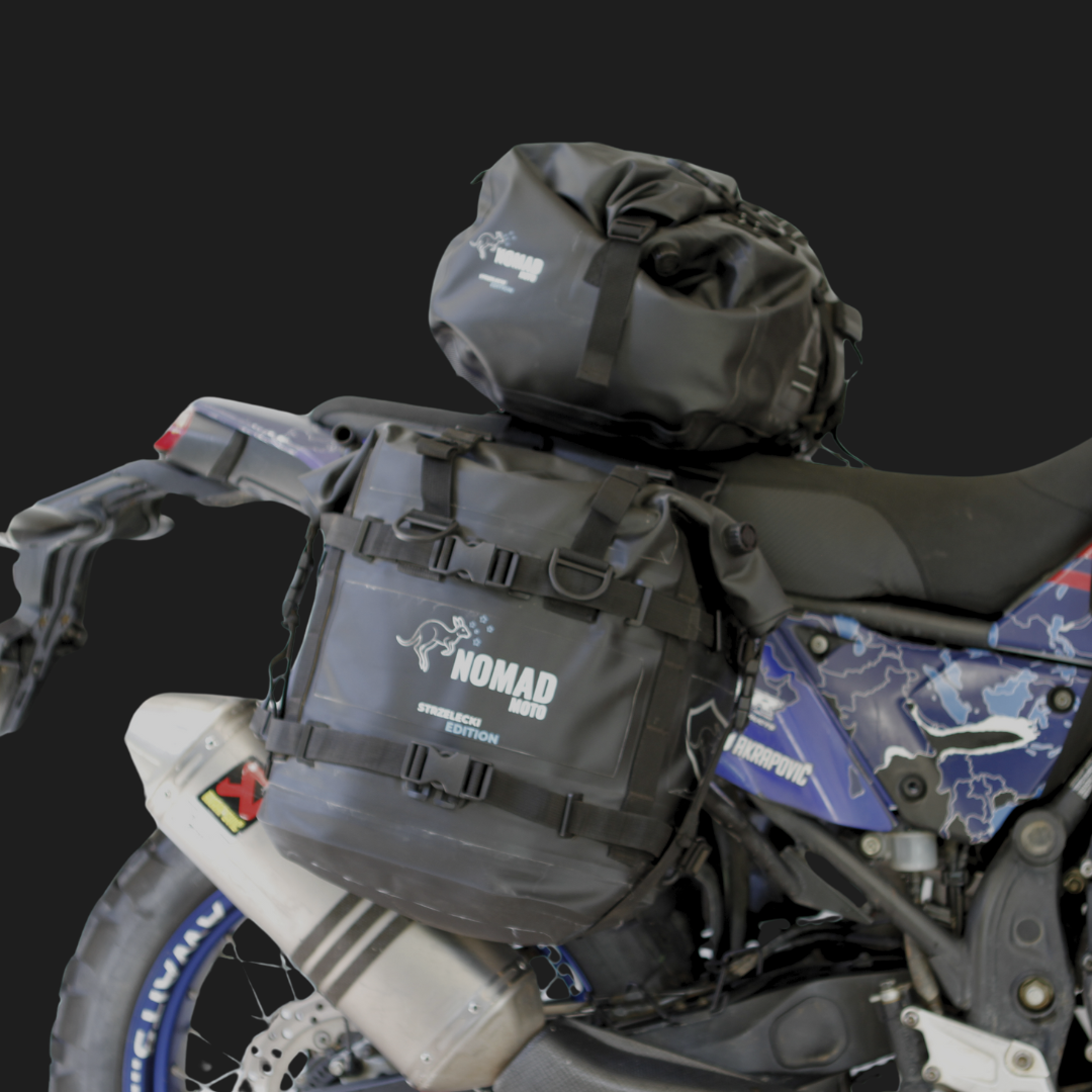 ADV motorcycle with NOMAD MOTO waterproof panniers and duffle bag