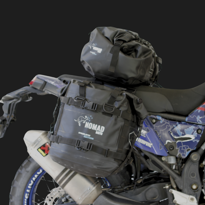 ADV motorcycle with NOMAD MOTO waterproof panniers and duffle bag